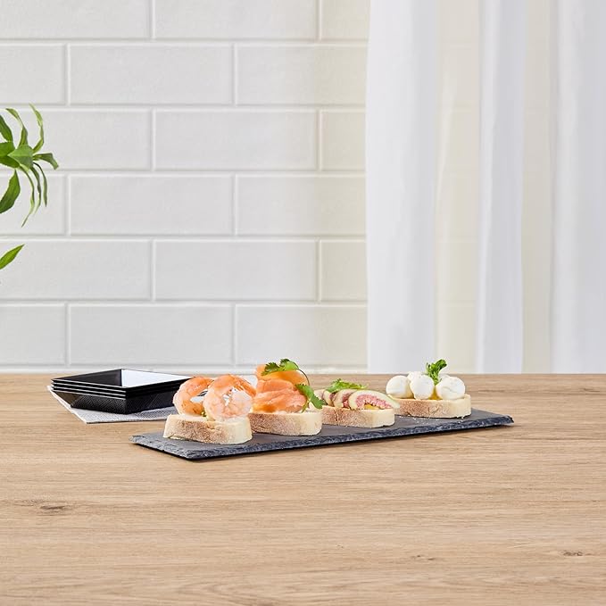 Restaurantware Slate Serving Trays 4 Pack of 11.8" x 4" Foam Feet Charcuterie Stone Plates Rustic Edges Freezable Black Serving Display Cheese Boards for Kitchen, Gourmet, Dining, Parties